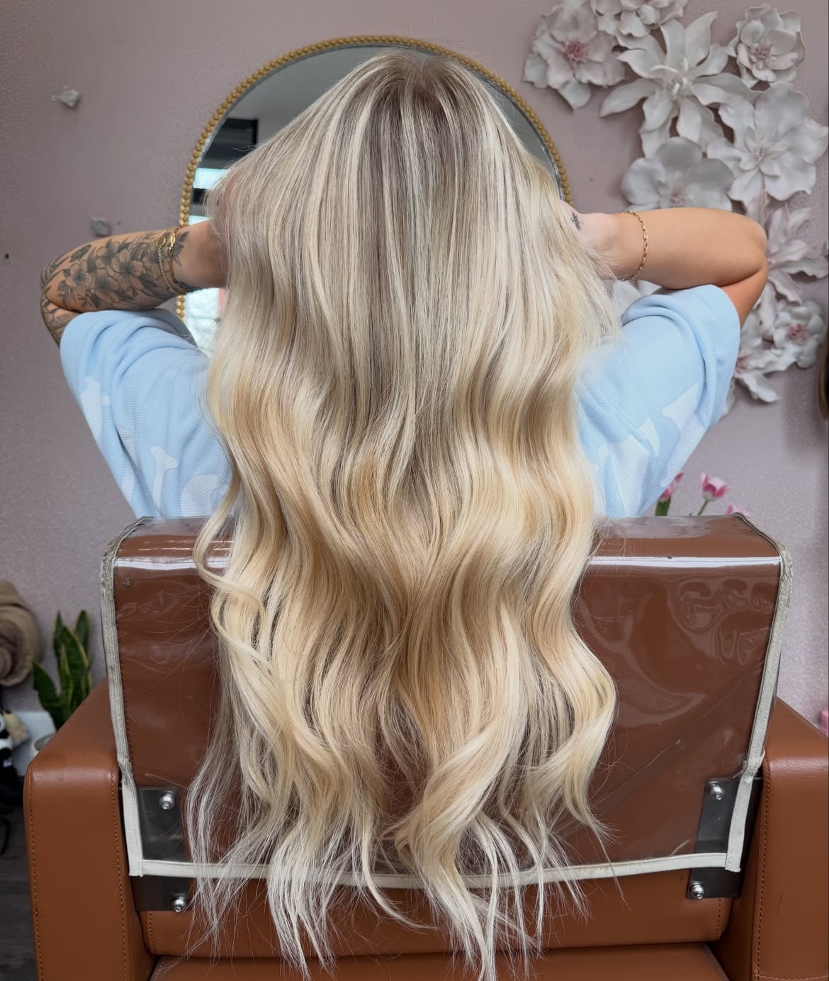 Sun-lit blonde extensions with soft waves