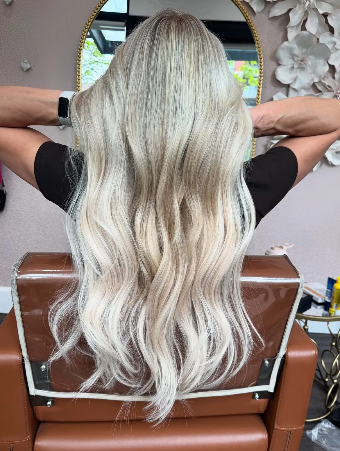 Tape-in extensions creating seamless blonde length and natural movement